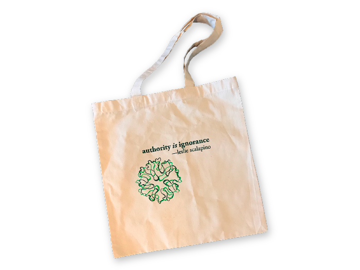 white Leslie Scalapino Tote with Litmus logo and Scalapino quote, "authority is ignorance"